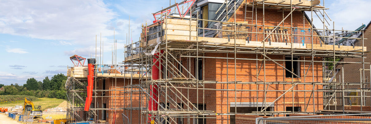 House with scaffolding being built