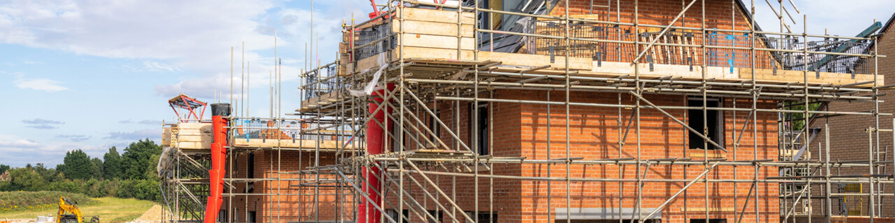 House with scaffolding being built