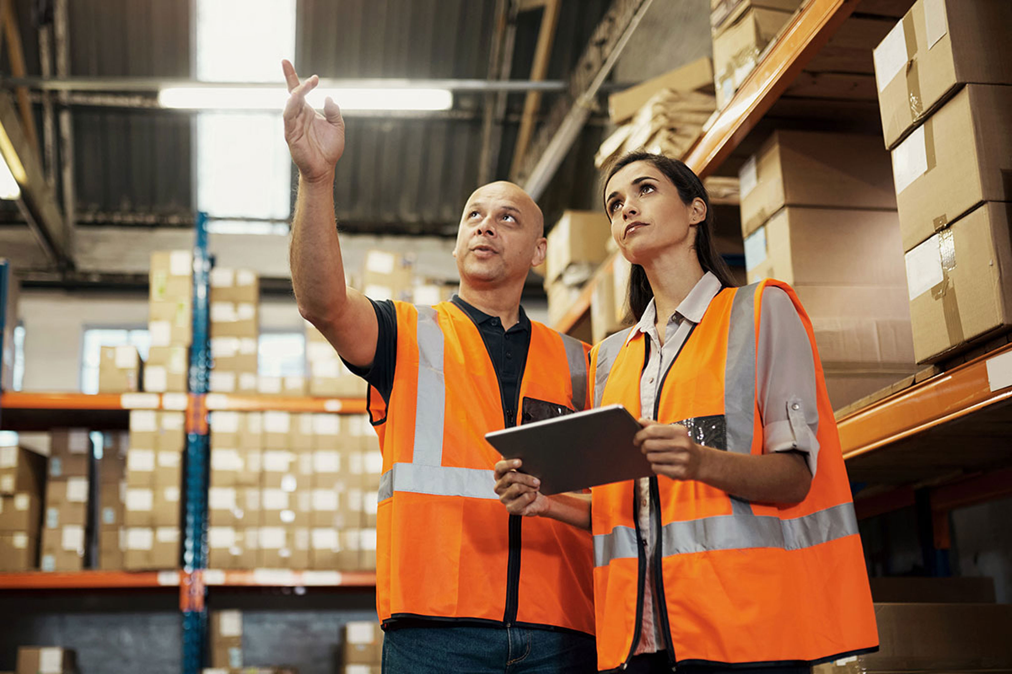 Warehouse staff in high visibility jackets
