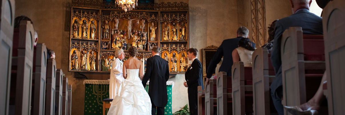 Bride And Groom Standing At The Alter