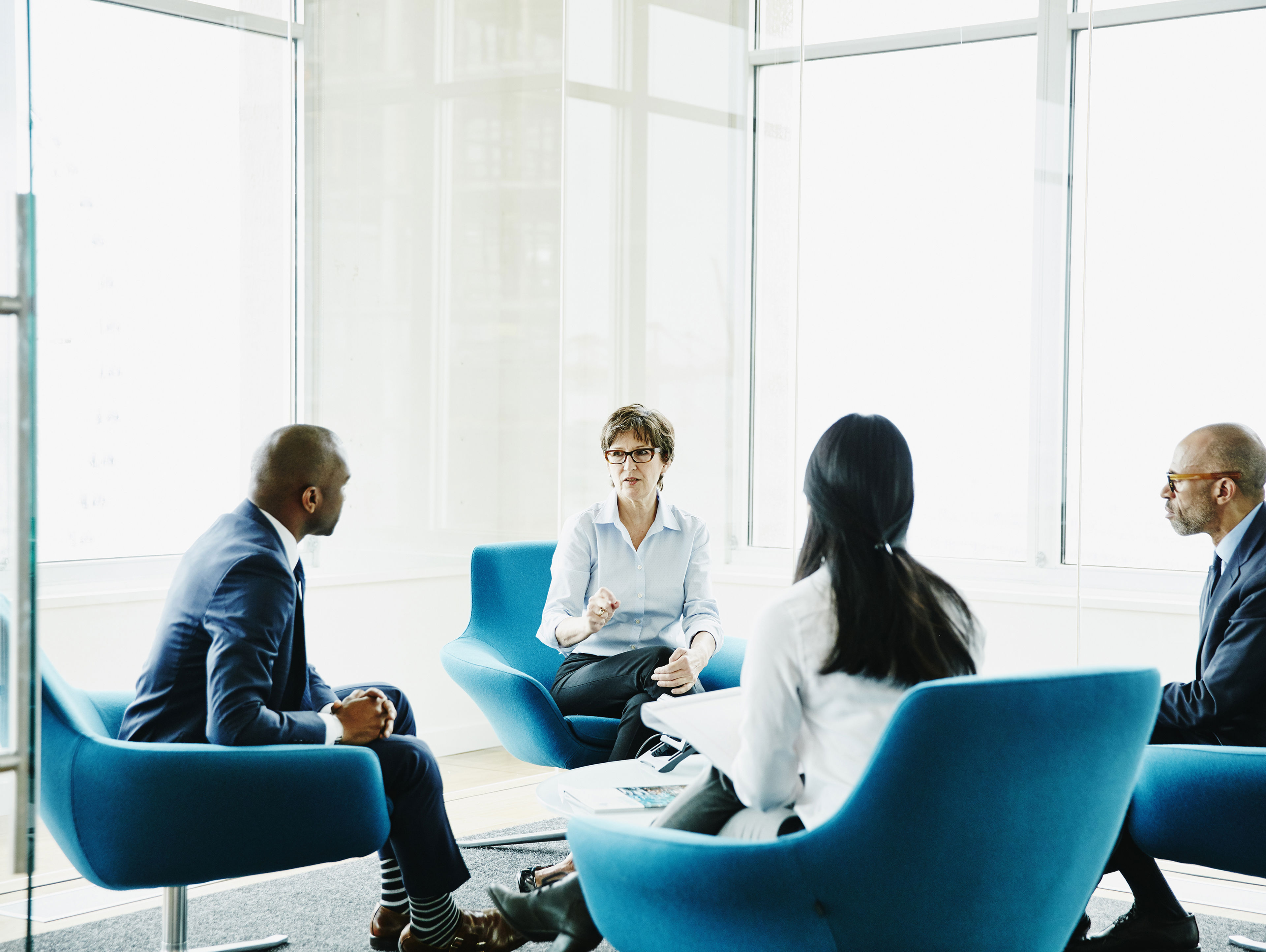 Businesswoman Leading Meeting In Office