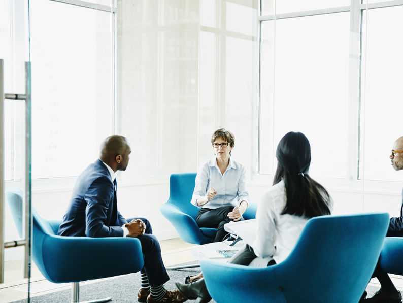Businesswoman Leading Meeting In Office