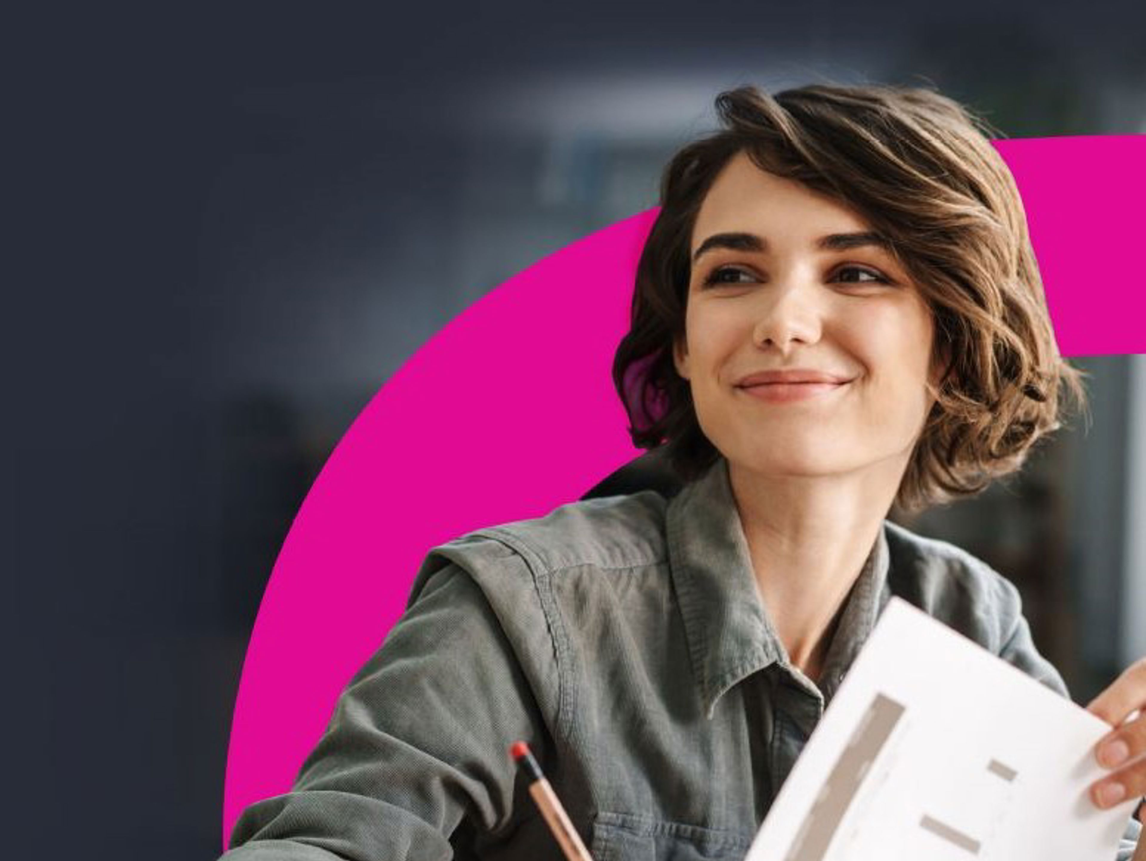 A smiling woman with short brown hair holds papers with charts and a pencil. She is seated against a dark background with a bright pink curved shape behind her.