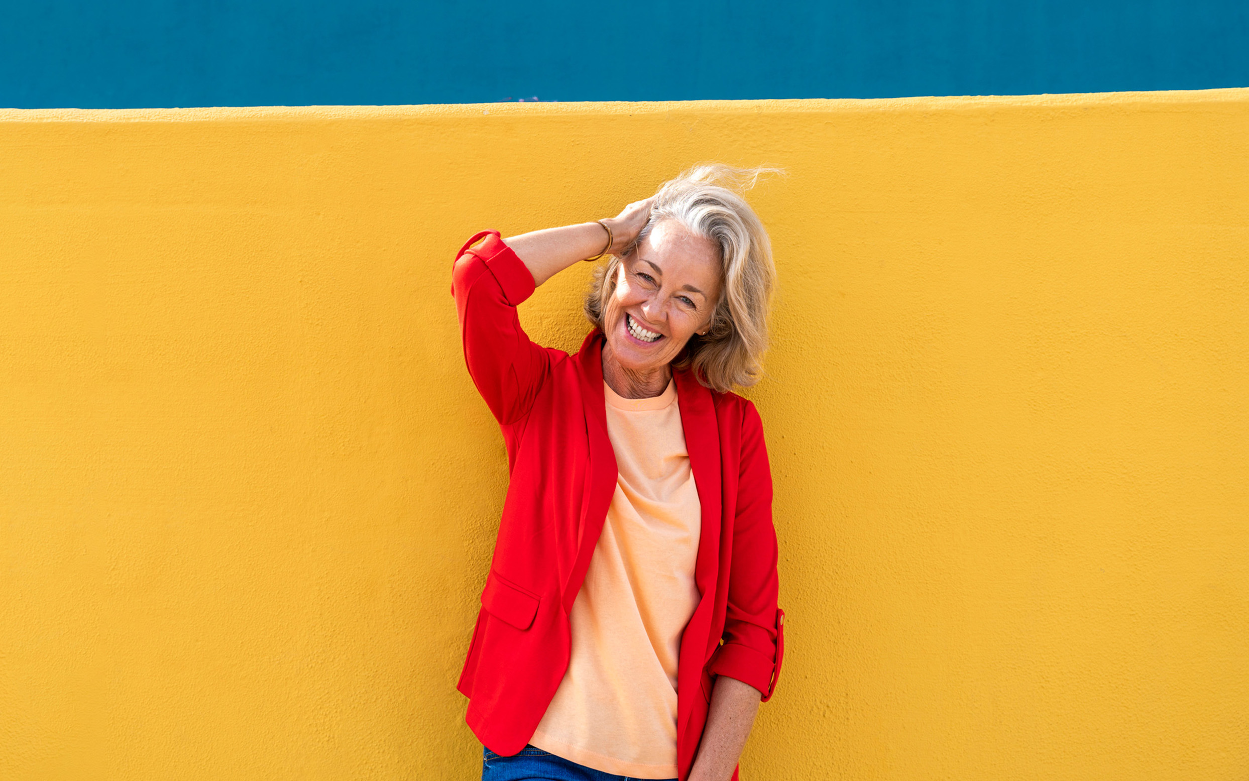 Image shows five glass jars, each containing coins and labeled with different categories: Travel, House, Charity, Car, and Health. The jars are arranged in a row on a white surface against a plain background.