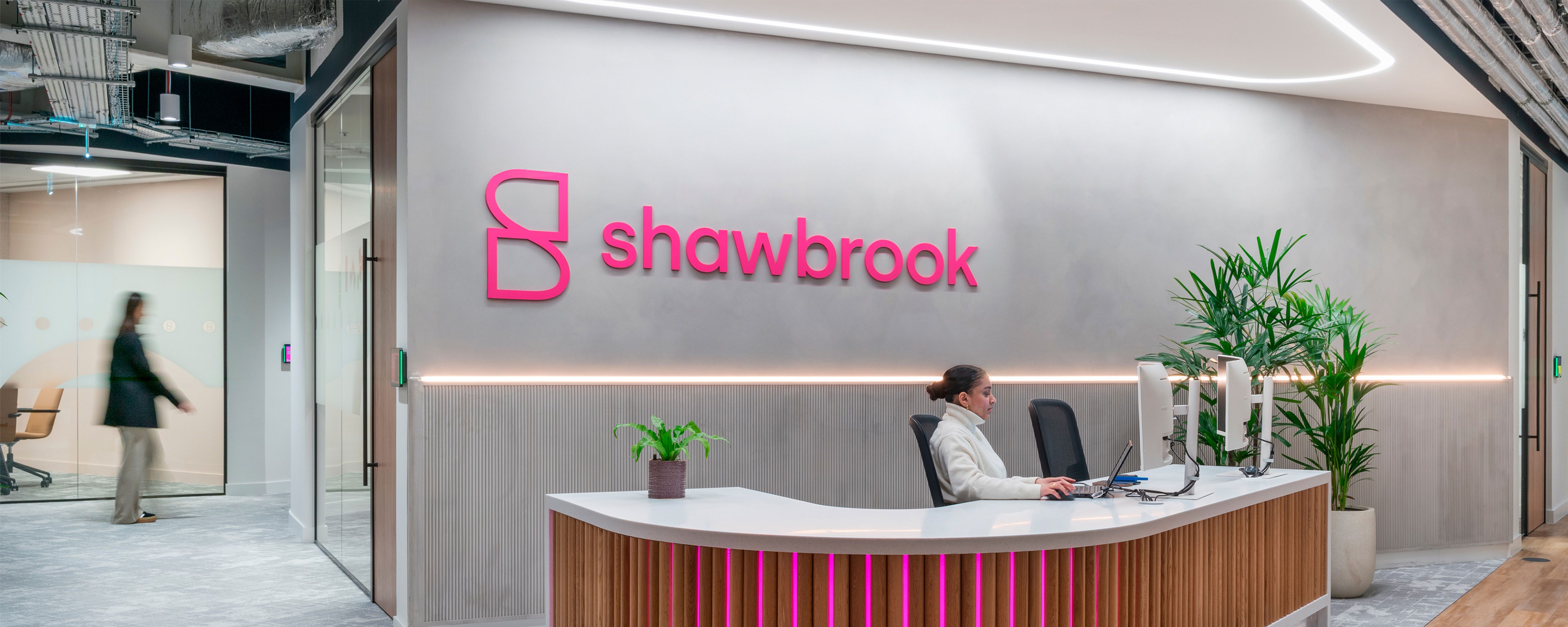 A woman sitting at a desk.