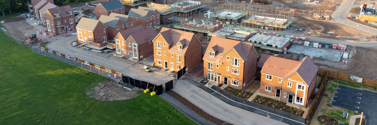 Aerial view looking down on new build housing construction site in England, UK