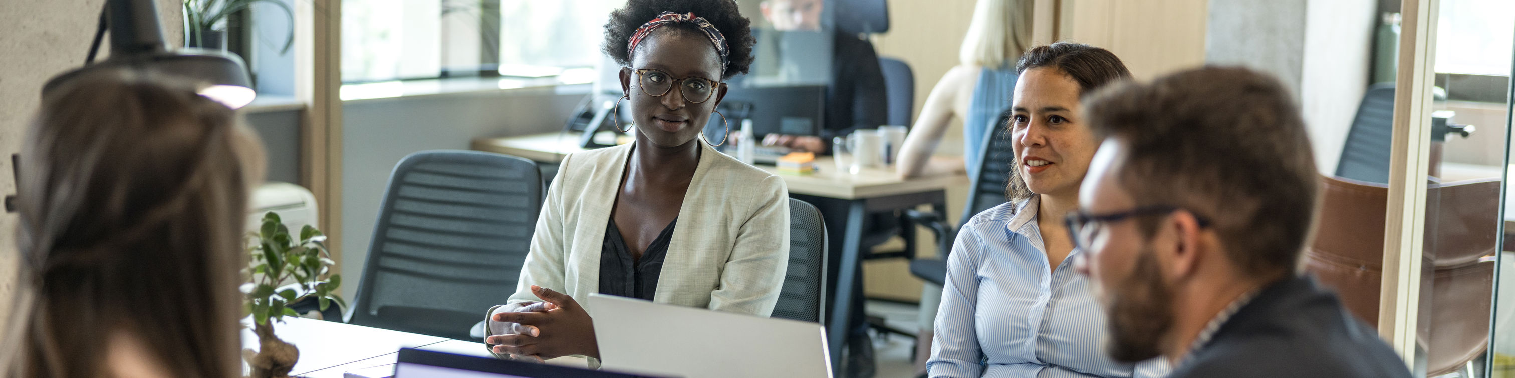 Casual Talk During Office Lunch Hour Between Multiracial Colleagues
