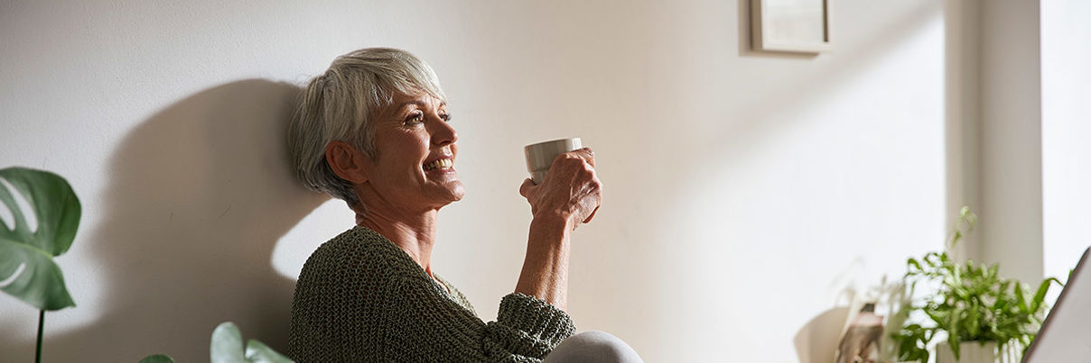 Lady Drinking Coffee From White Cup