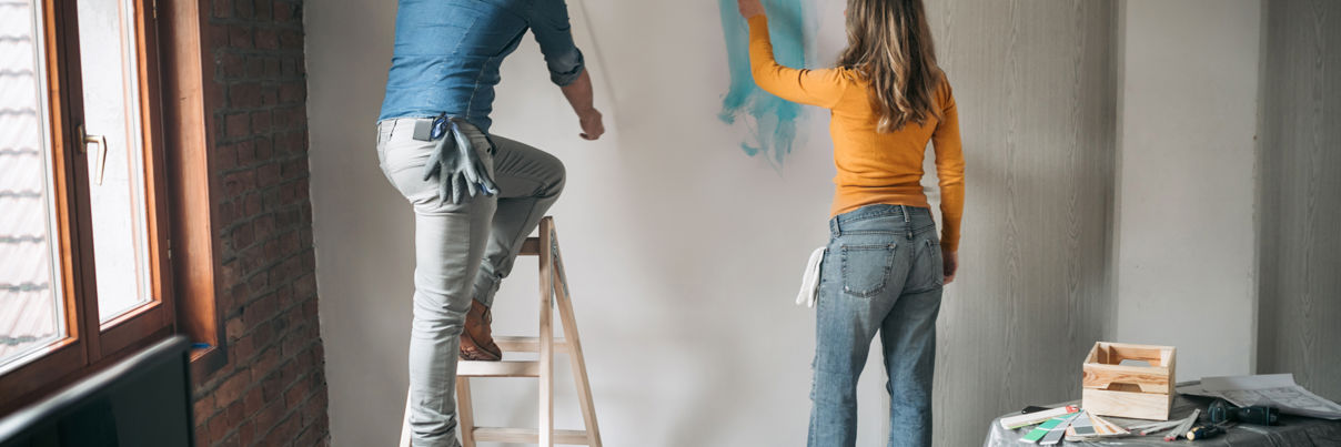 Couple Painting Apartment Together