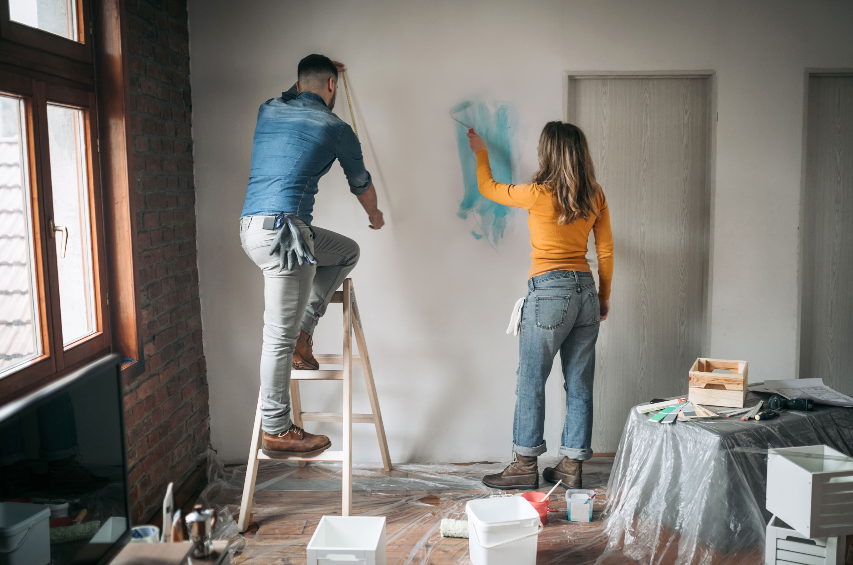 Couple Painting Apartment Together