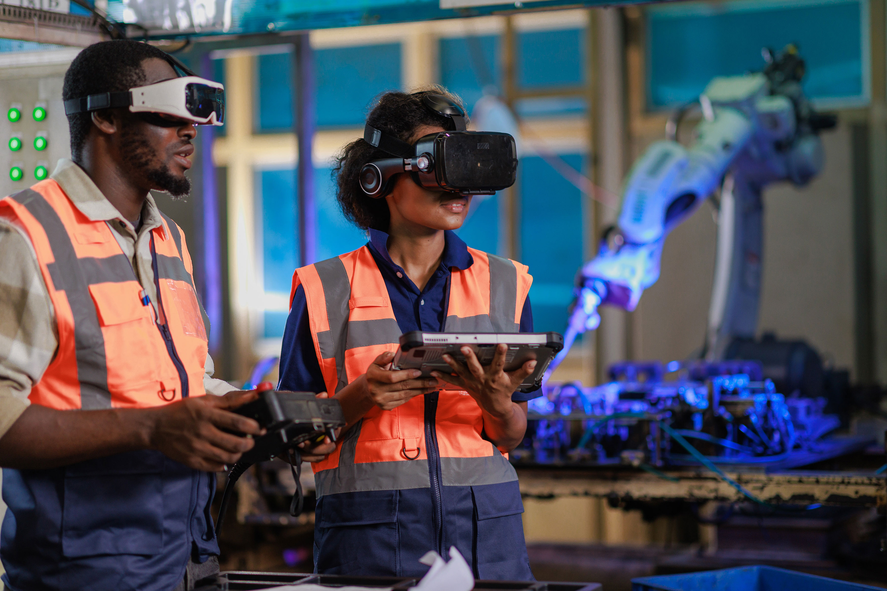 Engineer Using VR Glasses For Controlling A Robotic Welding Arm