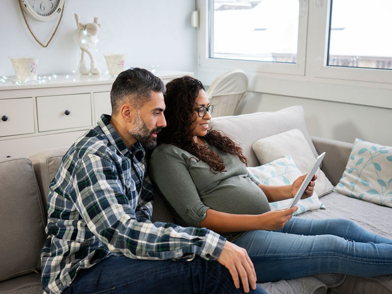 Couple Looking At Tablet