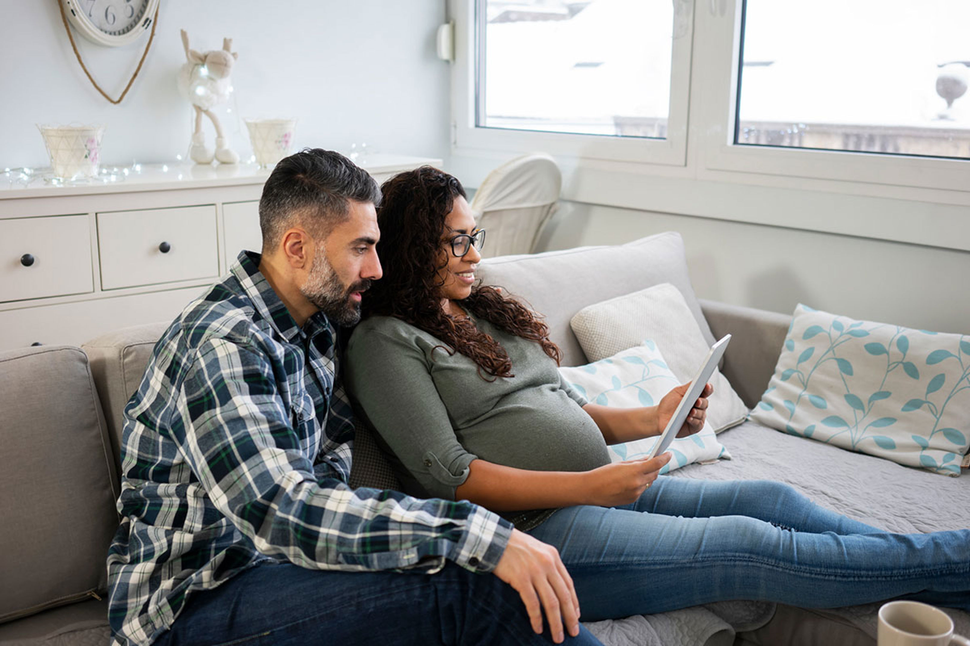Couple Looking At Tablet
