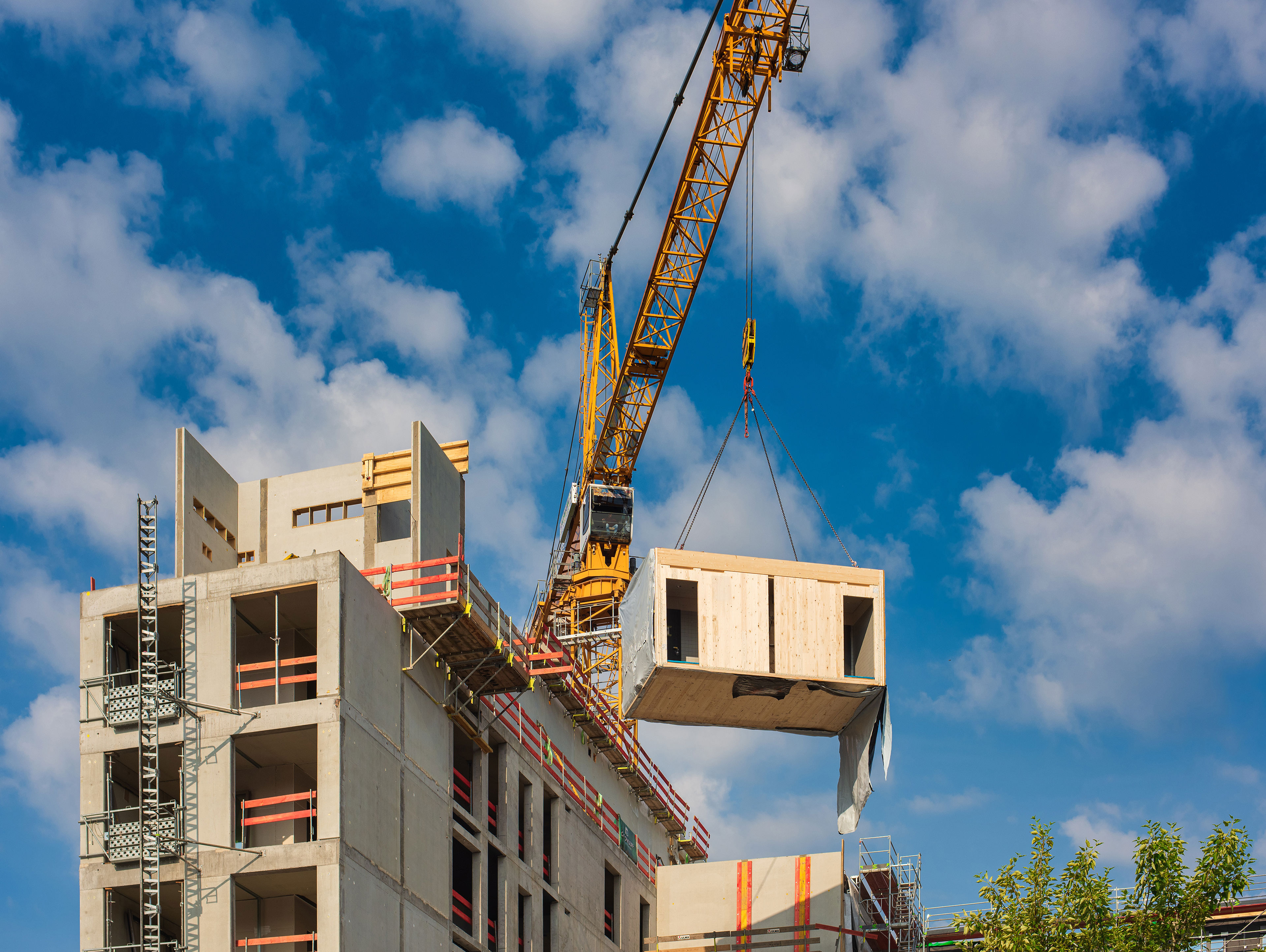 Crane Lifting A Prefabricated Wooden Building Module