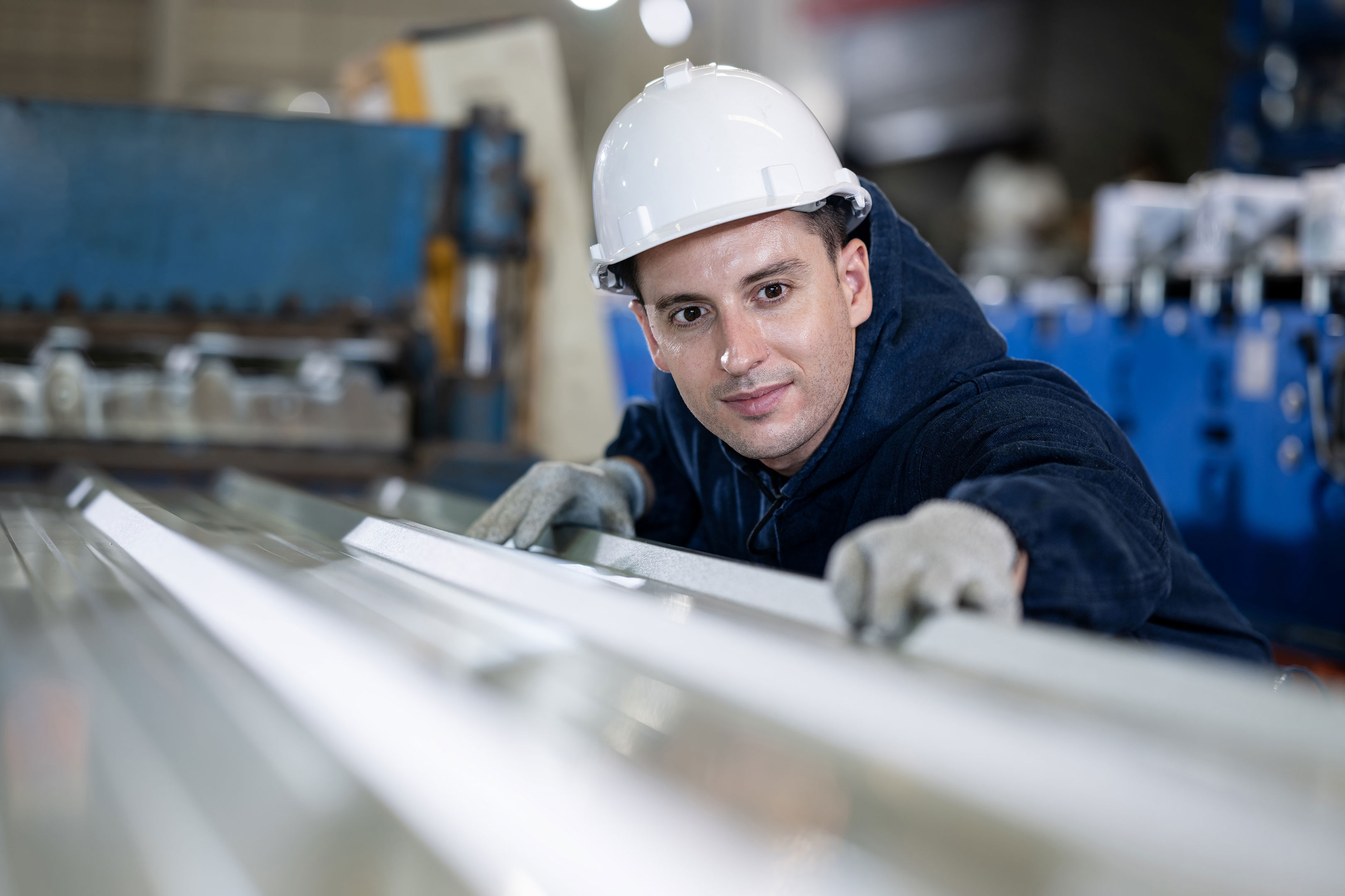 Quality Control Engineer Examines The Surface Of The Sheet