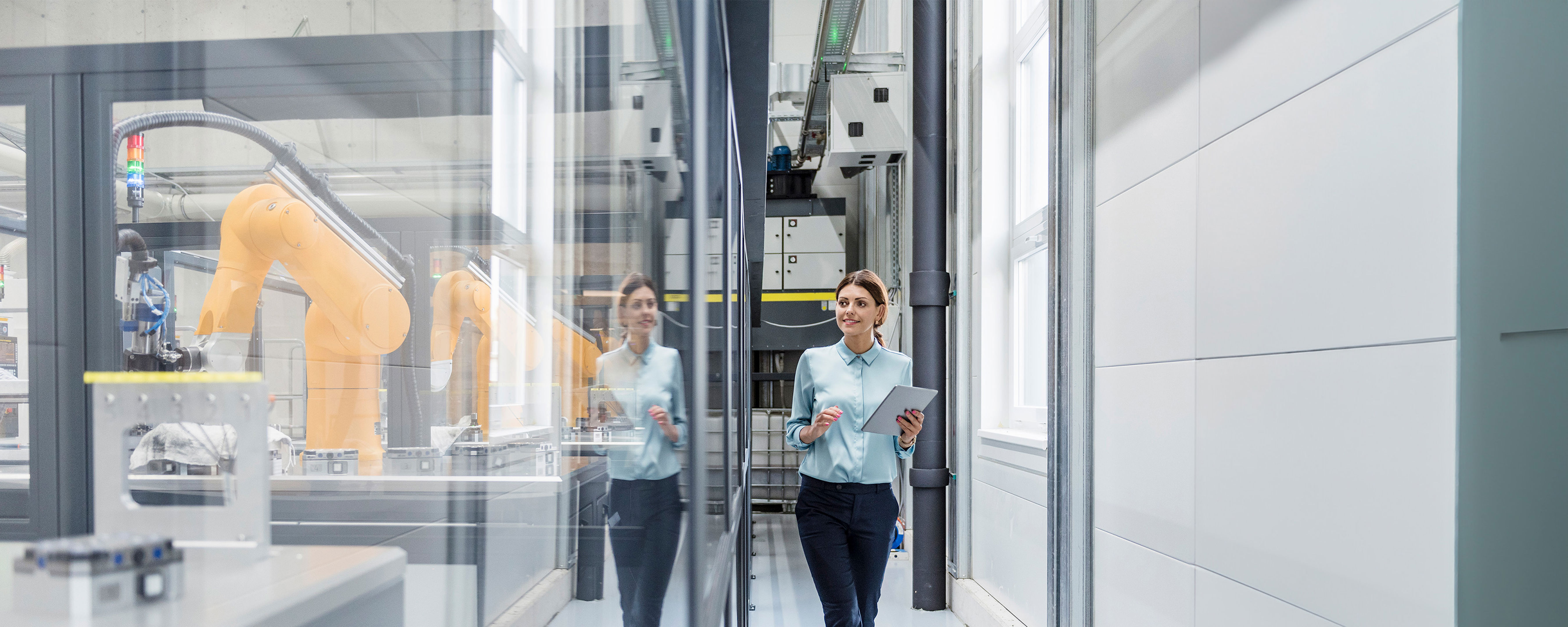 Businesswoman Checking Robots With Digital Tablet