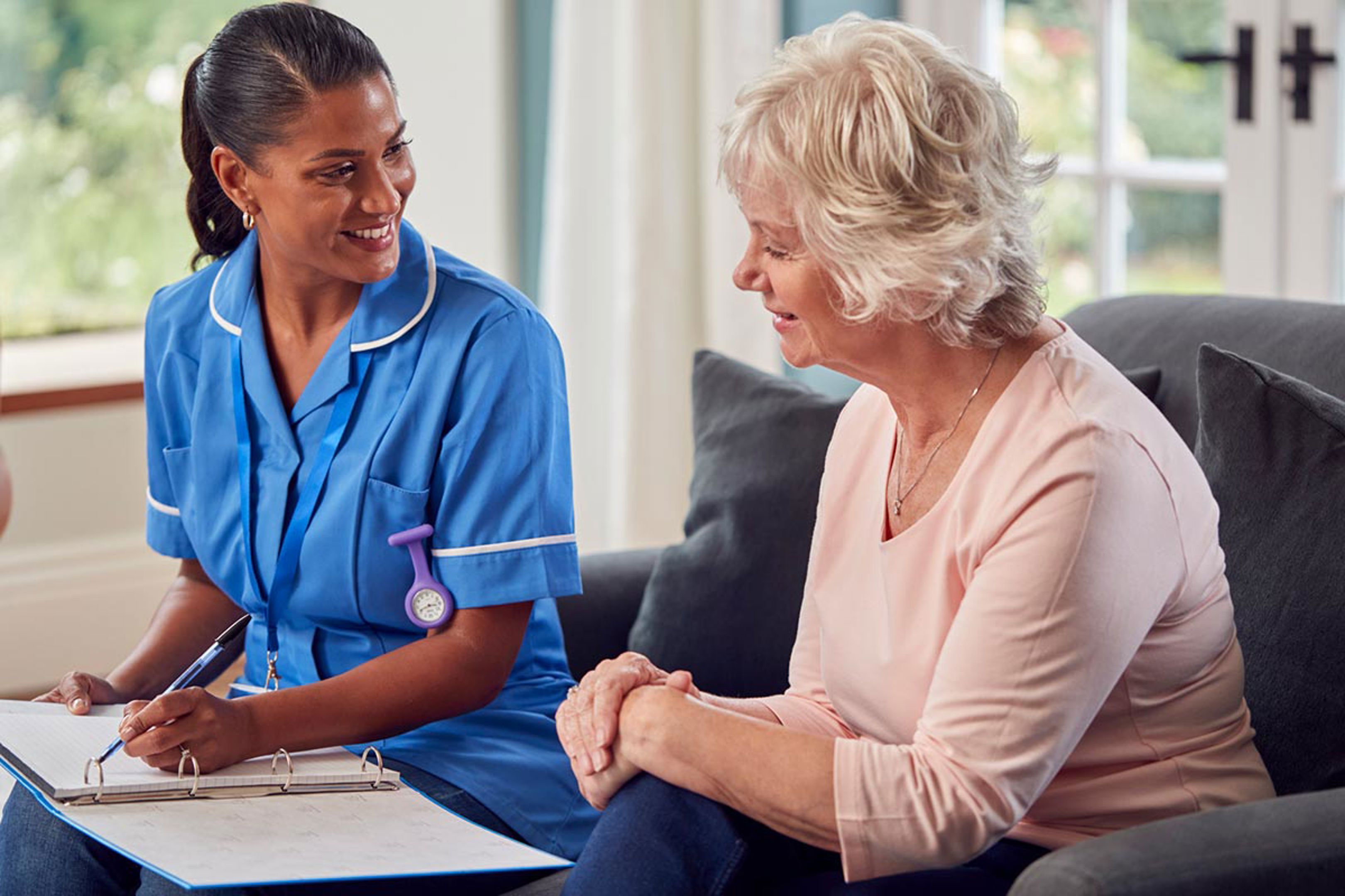 Nurse talking with female patient