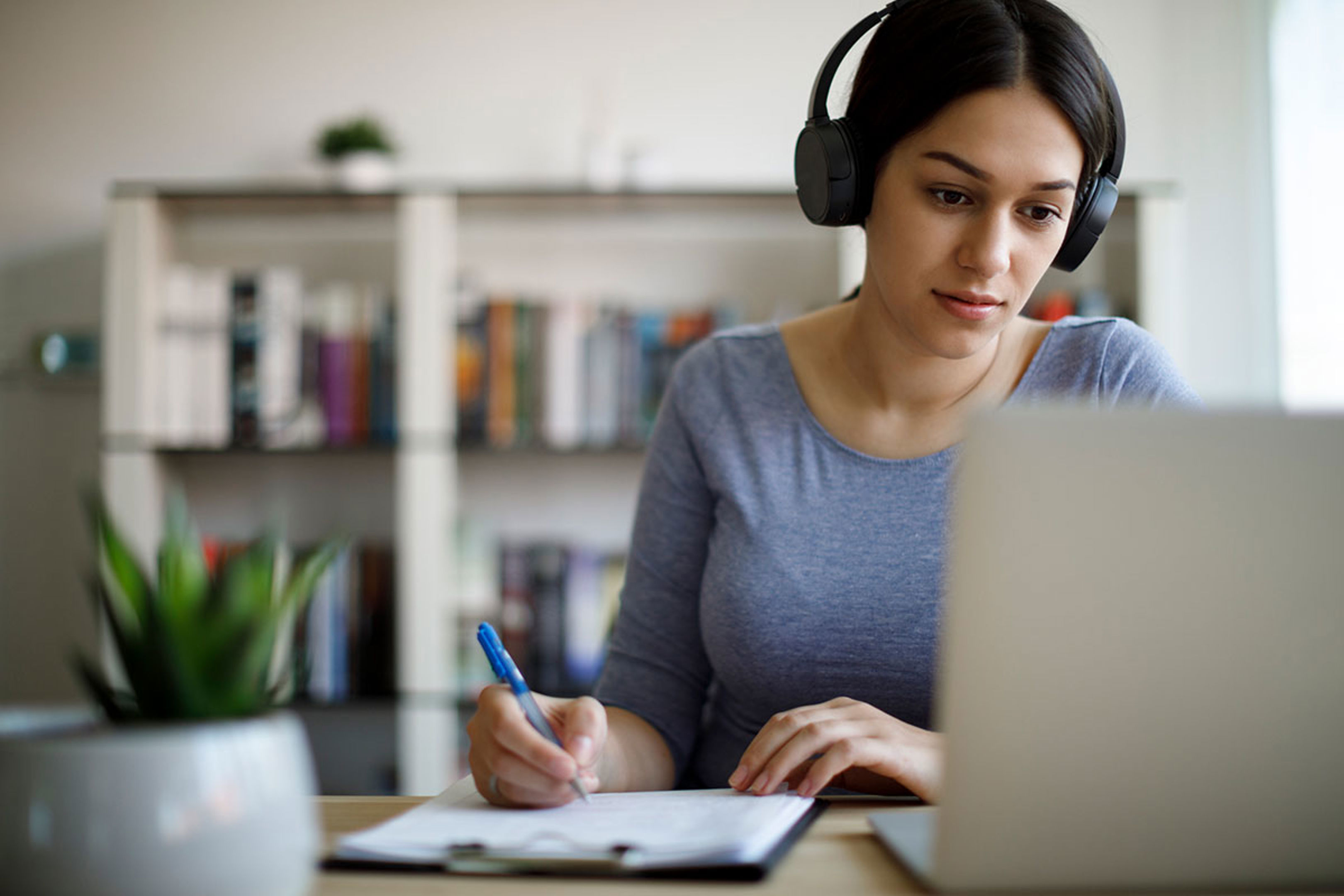 Woman working with headphones on