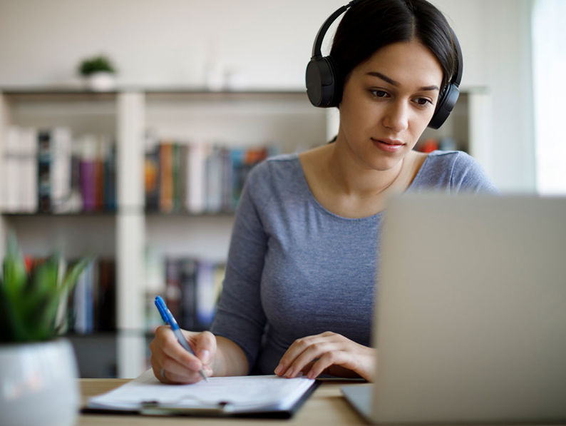 Woman working with headphones on