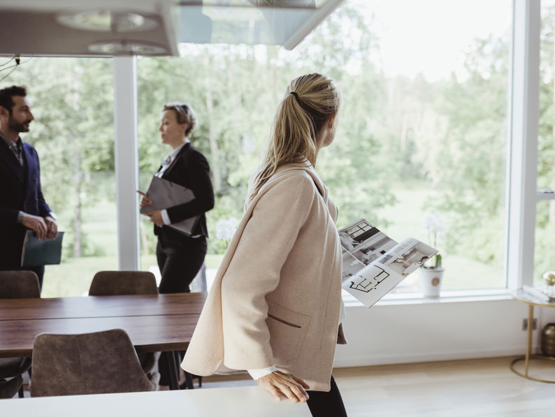 Couple Consulting With Estate Agent