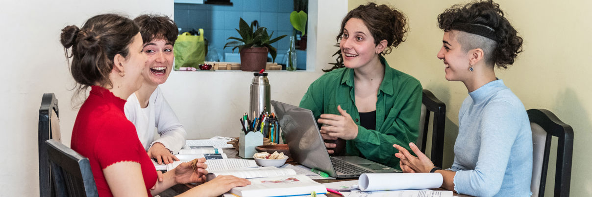 Friends Having Fun While Studying At Home