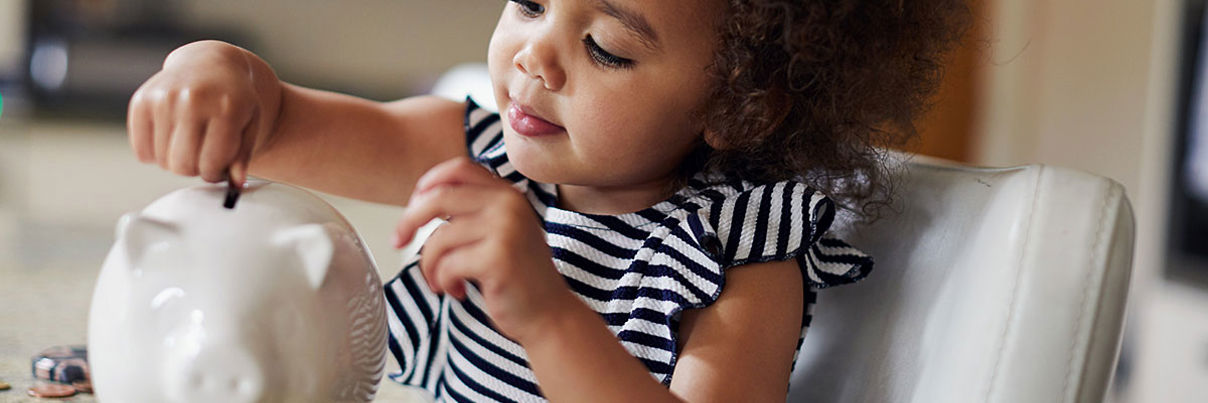 Child With Piggy Bank