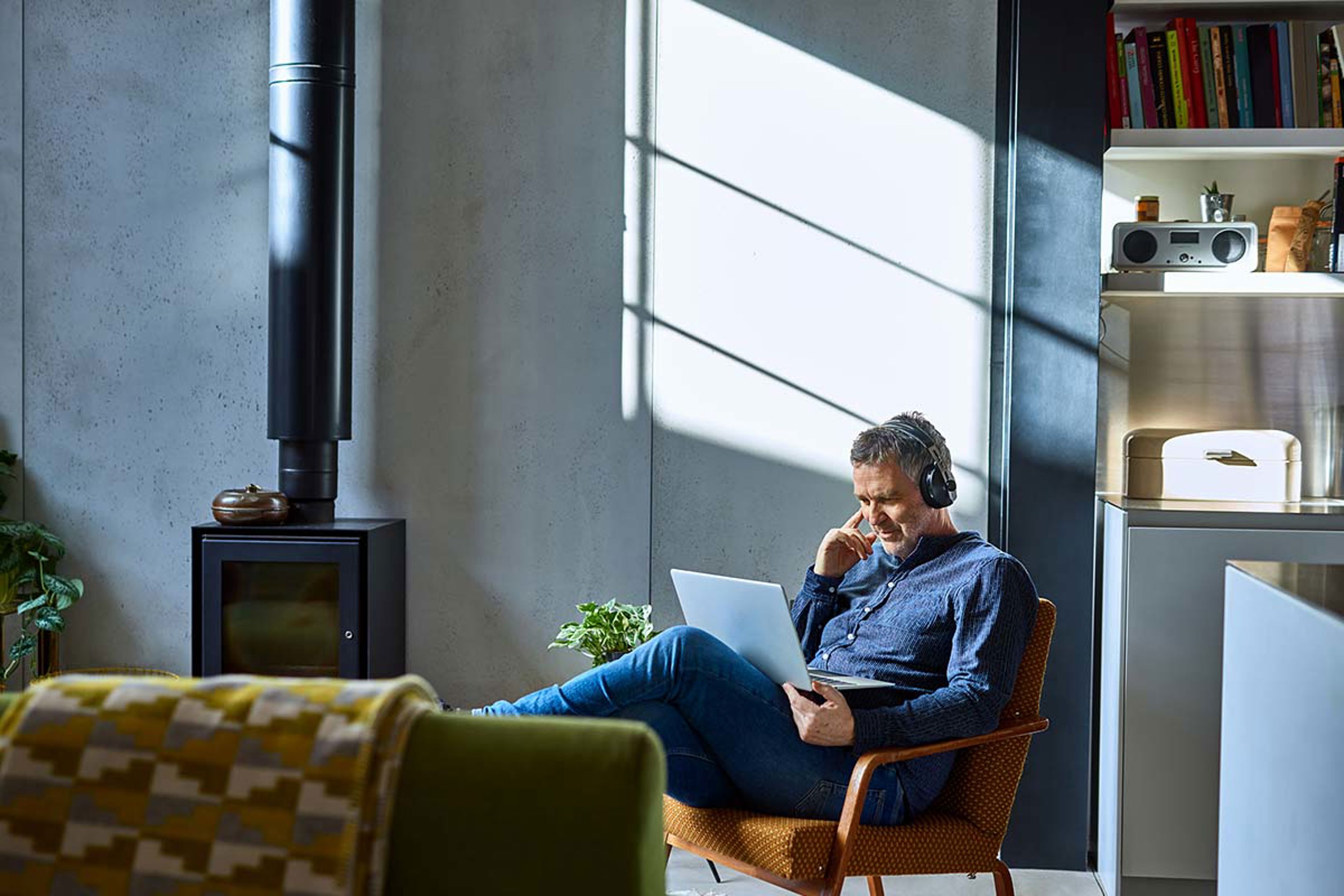 Man On Laptop With Headphones
