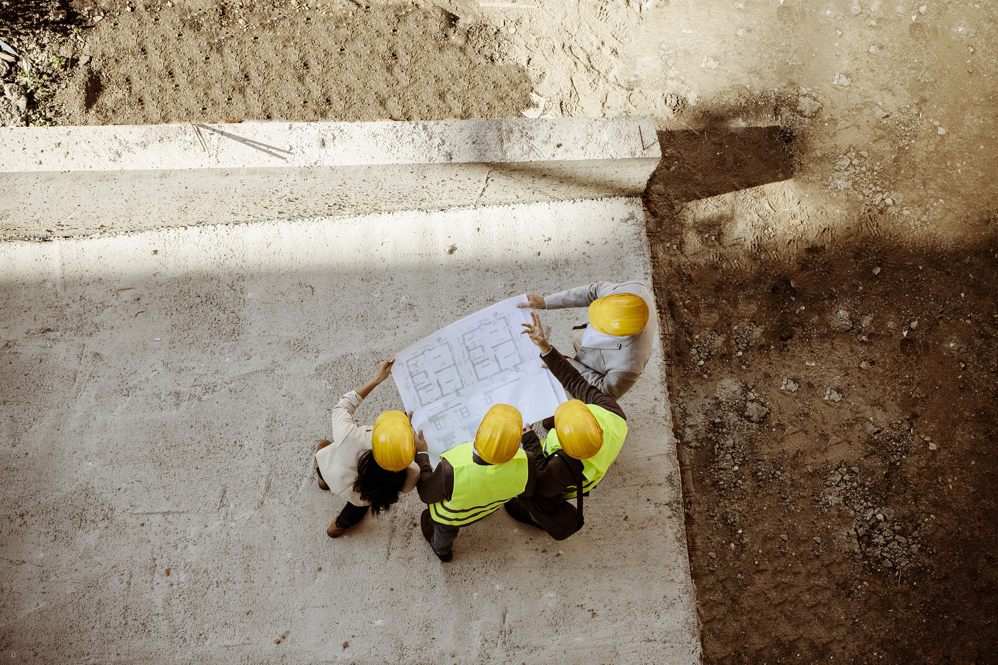 Architects And Engineer With Blueprints